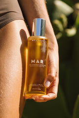 mar: óleo corporal